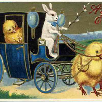 A Joyful Easter: This greeting postcard depicts a whimsical Easter-themed scene featuring anthropomorphic animals: a white rabbit dressed in a blue collar acting as a coachman for a blue vintage-style carriage, in which a large chick is seated in the back, while two chicks, outfitted with harnesses, pull the carriage. Above the rabbit, the words "A Joyful Easter" are written against a clear sky, implying a celebratory holiday theme. The setting appears peaceful with a hint of spring.