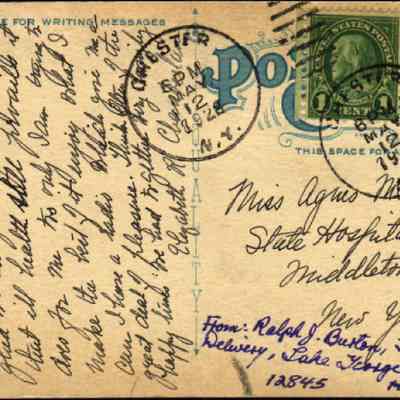Address side of "Business Section, Upper Chester, Chester, N.Y." postcard: The image depicts the back of an early 20th-century postcard with a handwritten message addressed to Miss Agnes McCann at the State Hospital in Middletown, New York. The postcard features two green one-cent stamps and postmarks from Manchester and Chester, including a date stamp from May 12, 1928. The message is written in elegant cursive, filling the space reserved for correspondence.