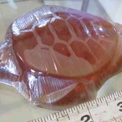 Nag Champa Moondancer Soap: The image shows a translucent turtle-shaped bar of Nag Champa Moondancer Soap beside a ruler for scale.