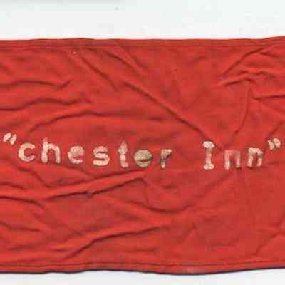 Chester Inn souvenir: German WWII Political NSDAP Armband.: The image shows a red armband with a swastika symbol and text, including "chester Inn 45 div, German – 1945."