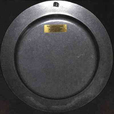 Orange County Volunteer Firemens Annual Parade Plate - back: The image shows a dark circular plaque with a gold label, displaying contact information.