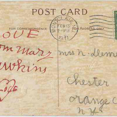 Address side of the "To One I Love" greeting postcard.: The image depicts an old postcard, dated February 13, 1911, featuring a green one-cent stamp and a Montclair, NJ postmark. It is addressed to Mrs. N. Demarest in Chester, Orange Co., N.Y. The message side shows a handwritten note that reads "Love from Mary Hawkins" with a heart written in red, all set on a beige background. The card also indicates areas designated for correspondence and address.