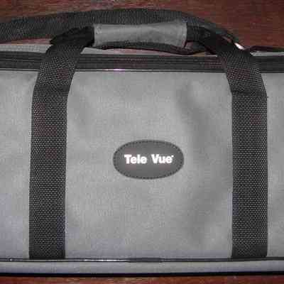 Brass TV-85 Telescope Case: The image features a gray carrying case with "Tele Vue" written on a small, black, oval.