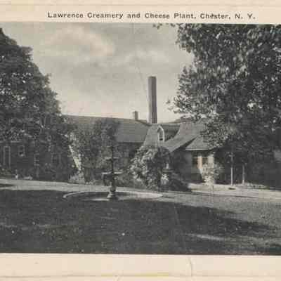 Lawrence Creamery & Cheese Plant.: The image shows the Lawrence Creamery and Cheese Plant in Chester, New York, surrounded by trees.