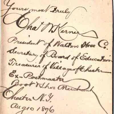 Charles W. Kerner reverse: The image shows a handwritten note signed by "ChasW. Kerner," who identifies himself as the President of National Hose Co., Secretary of Board of Education, Treasurer of Village of Chester, and Ex-Postmaster. The note is dated August 1896 and is written on the reverse of this Cabinet Card with some numbers and notes scribbled below the note, indicating it was used in the 1995 Centennial Book of the Village of Chester. The writing style is cursive and somewhat elaborate, typical of the late 19th century.