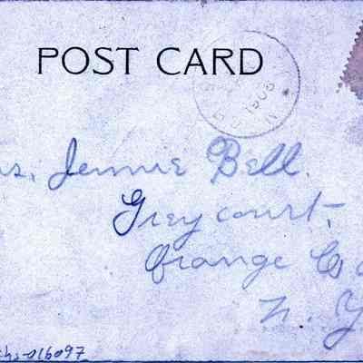Lackawanna Station, Morristown, N.J. versa: The image displays a vintage postcard, addressed to "Mrs. Jennie Bell" in a cursive script. It is sent to Greyourt, Orange Co., N.Y., and features a postmark dated December 24, 1906. A one-cent stamp partly torn appears in the top right corner, and the postcard itself shows signs of aging with stains and slight tears, predominantly visible in the upper part and edges.