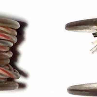 2 ea Chester Cable Wire Spools - edge view.: The image shows two spools of wire, one with a multi-colored plastic sheath and another with green fabric sheath.