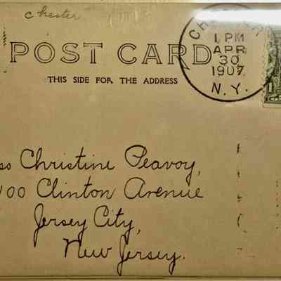 The image features a vintage postcard addressed to Miss Christine Peavoy at 100 Clinton Avenue, Jersey City, New Jersey. The postcard has a postmark from April 30, 1907, originating in Chester, New York. It prominently displays a one-cent green Benjamin Franklin stamp in the top right corner. The handwriting on the postcard is elegant and clear, typical of the early 20th century. The word 'POST CARD' is printed in large letters at the top of the card, indicating the side designated for addressing. The overall appearance suggests a personal correspondence from over a century ago, offering a glimpse into historical communication methods.