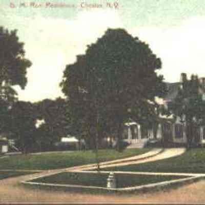GM Roe Residence Post Card - to Mrs. J.D. Mapes: The image shows a large elegant house, the residence of George M. Roe, surrounded by manicured gardens and pathways in Chester, N.Y.