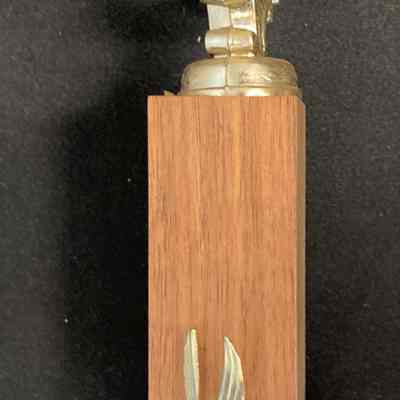 Chart Member Chester Volunteer Ambulance Corp - Henry Lutjens - Right: The image shows the right side of a golden ambulance trophy atop a wooden base, featuring a small eagle detail.