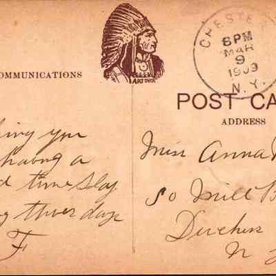 “Chester, N.Y. R.C. Church and Rectory” Back: The image shows the back of a vintage postcard, marked and postmarked from Chester, New York on March 9, 1909 at 8 PM. The card features a green one-cent Benjamin Franklin stamp in the top right corner and is addressed to Miss Annah M. Clark of South Mill Brook, Duchness County, New York. On the left side, under the heading "COMMUNICATIONS" printed along with the identifier "3422 Printed in Germany", there is a handwritten message that reads: “Hoping you are having a good time. Staying there day -F”. Additionally, there's a printed graphic of a Native American in profile, titled "ART NOUVEAU".
