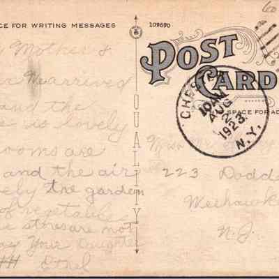 “St. Columbia Church, Parsonage and School, Chester, N.Y.” Back: The image shows a vintage postcard dated August 2, 1923, featuring handwritten correspondence on the left side and postal markings on the right. The text, addressed to "Mother" from "Ethel," describes a pleasant environment, mentions safe arrival, lovely places, spacious rooms, fresh air, and a garden full of vegetables, conveying the sender's contentment. The right-hand side has a green one-cent stamp and the destination address in Weehawken, N.J. The separation line down the center of the card marks spaces for writing messages and the address.