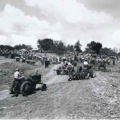 Tractors clearing fields