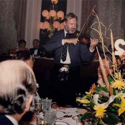 John R. Turner Playing Fiddle for Dinner Guests at 50th Anniversary Dinner
