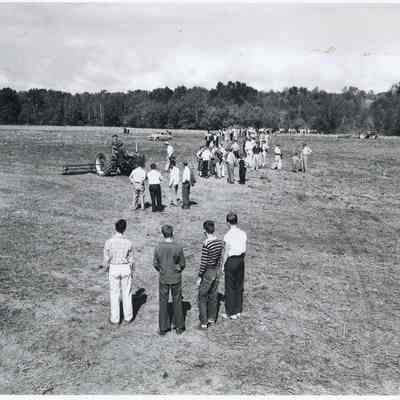 Boys watch the field clearing