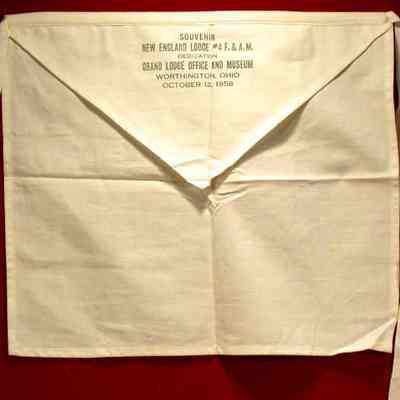 Apron: SOuvenir apron of the dedication of the Grand Lodge Office and Museum dated October 12, 1956. Signed by Frank W. Nicholas, Grand Master