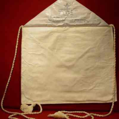 Apron: White lambskin. 12 1/2" x 14" with following under flap: "Carlos R. Pember, E.A. 3/13/24, F.C. 5/22/24, M.M. 6/28/24, Howell Secy. W. M. Phelps
