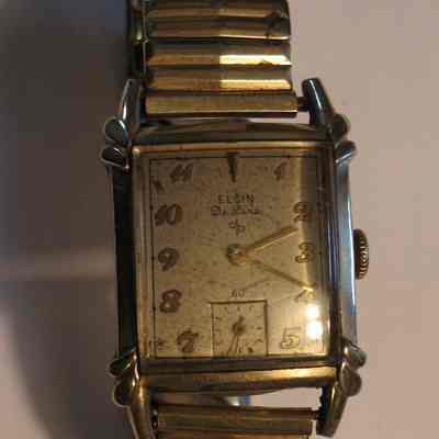 Wristwatch: Gold Elgin wristwatch with square face. Inscription on the back reads: "Presented by Sencerity Lodge No. 694 F&AM to Russell O. Hotchkiss 26th P.M. 1950"