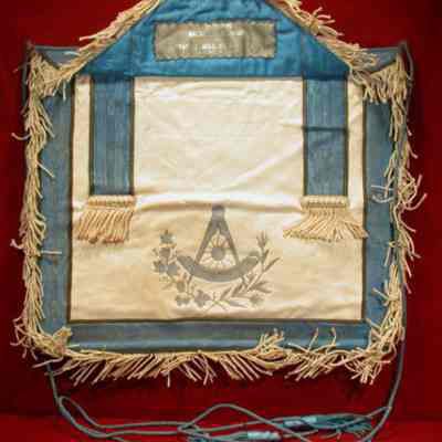 Past Masters apron, white with blue border and emblem, tabs. 13" x 16" white and blue, flap with Eye presented to M. W. Bro. Samuel H. Squire by Newburgh Lodge #379 on Marcy 20, 1931