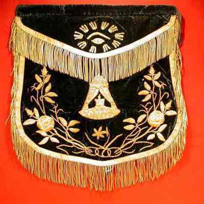 Apron: Black felt, gold edging. 16" x 17". All Seeing Eye on flap and design on body all in gold