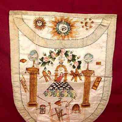 Apron: White silk with green silk borders. 18" x 14 1/4" very colorful designs