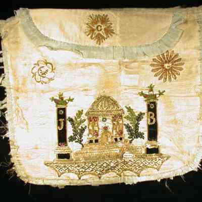 Apron: Eastern Star apron white silk with blue silk border. Initials "J" "B" on columns. Note on envelope "Siege Belgium liberated by First Marine troops from ravaged temple". Decorated