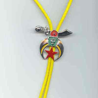 Jewelry: Bolo tie with Shrine emblem. Silver color with red and green, yellow cord