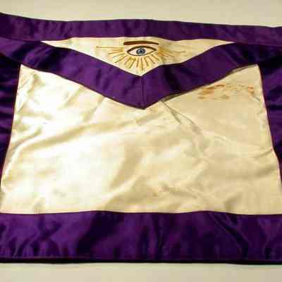 Apron: Grand Lodge Officer, District Deputy Grand Master. Belonged to Robert Parrish. Purple and white