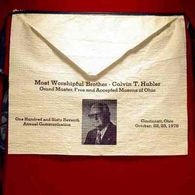 Apron: White paper with blue printing. 167th Annual Communication, Cincinnati, Ohio, October 22-23, 1976. Picture of Calvin T. Hubler. 15" x 12"