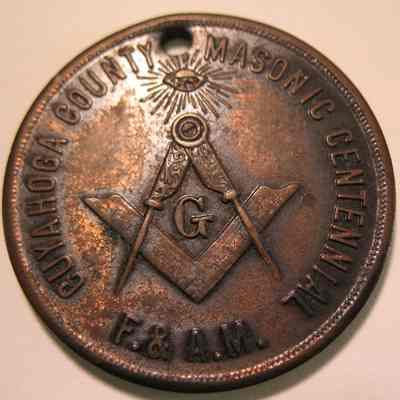Coin, COmmemorative: All-Seeing EYe, Square & Compass, Cuyahoga County Masonic Centennial F&AM. On the back: "Masonic Light in Cuyahoga Co. Ohio,m A.L. 5812, 36 members, A.L. 5912. 9000 members". 1 1/4" diam copper coin with a brilled hole