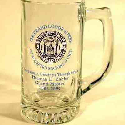 Glass: Beer Mug 5 3/4"H x 2 3/4: diam. In blue print: "Freemasonry, Greatness through service. Thomas D. Zahler, Grand Master, 1993-1994." In bluye around a gold Grand Lodge Seal "The Grand Lodge of Free and Accepted Masons of Ohio" One of two ref. C.N. 2079