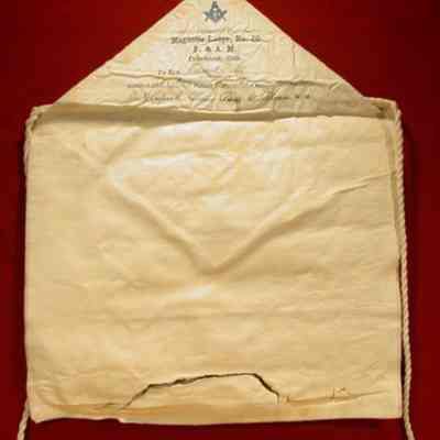 Apron: Wite lambskin with the following under flap: "Edward Beutz, E.A. Oct 27, 1914, F.C. Dec 15, 1914, M.M. Jan 27, 1915. 14" x 11 1/2"