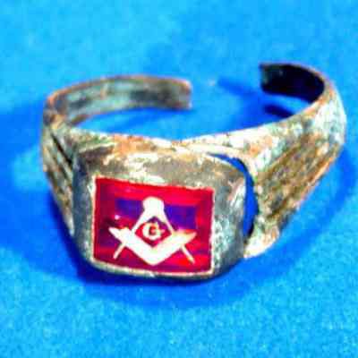 Ring: Masonic emblem in red. Gold band