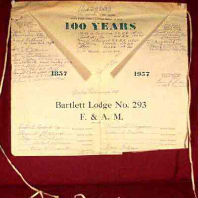 Apron: Paper apron from Bartlett Lodge #283, 100th Anniversary celebration. Apron signed by the officers of Barlett Lodge and distinguised guests.