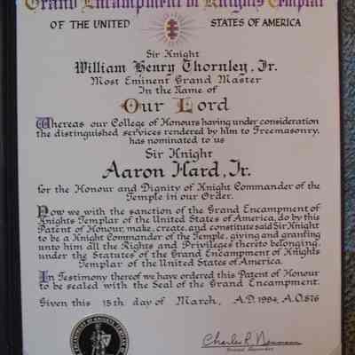 Certificate: Grand Encampment document establishing Aaron Hard, Jr. Knight COmmander of the Temple. The document is in an 11 3/8" x 9" purple hard cover. Print in gold on the cover "Grand Encampment of Knights Templar U.S.A."