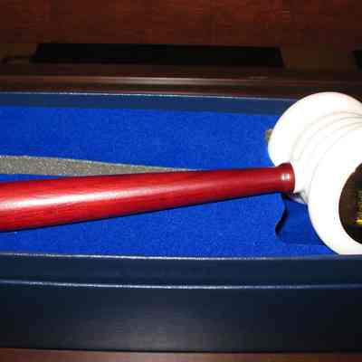 Gavel: George Washington Gavel. Engraved on te circular gold cap: "Presented to Grand Lodge of Ohio F & AM by Grand Lodge FAAM of DC Robert Starr GM. 10/18/02". White marble head with red wood handle. Gavel head: 3 1/4" wide and 3" in diameter.
