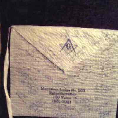 Apron: White paper apron with blue lettering commemorating the 150th Anniversary and Reconsecration of Marathon Lodge #203