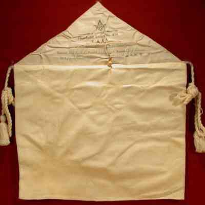 Apron: White lambskin. 14" x 12 1/2". Presented to Bro. J. B. Bradshaw, EA 12/7/25 FC 12/28/25 MM 1/13/26, Humboldt Lodge #475