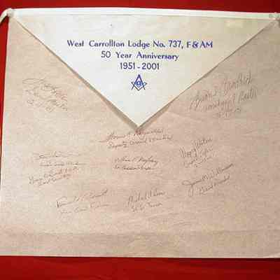 Apron: Paper apron 50th Anniversary of West Carrollton Lodge #737, dated 1951-2001. White paper apron signed by Grand Lodge Officers and the Worshipful Master of West Carrollton Lodge