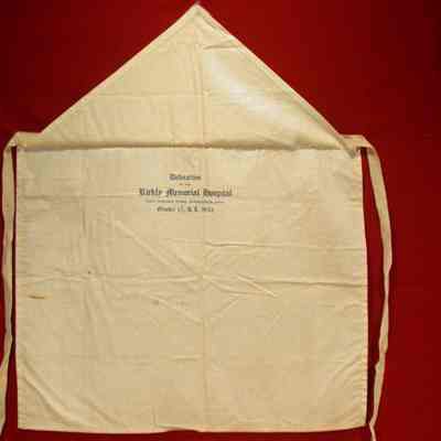 Apron: White cotton with blue printing. 12 3/4" x 15". Dedication of the Rickley Memorial Hospital, Ohio Masonic Home, Springfield, Ohio. October 17, 1923, AL 5923