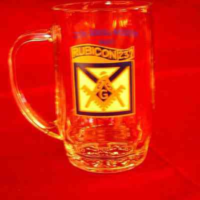 Glass: Glass mug celebrating the 150th Anniversary of Rubicon Lodge No. 237. (one of two mugs ref. C.N. 2080. Clear glass with white, blue, and gold design, blue lettering on reverse side. 1853-2003