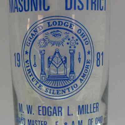 Glass: Clear glass with Ohio Grand Lodge seal on one side and a Square & Compass on the other. In print: "Friendly 15th Masonic District 1981 M.W. Edgar L. Miller Grand Master F & AM of Ohio: 5 1/2: x 2 3/4" diam.