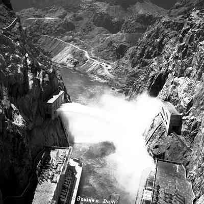 Hoover Dam, water pouring over spillway.