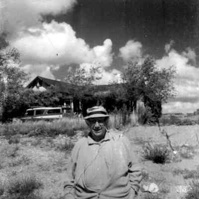 Andy Devine in front of old home