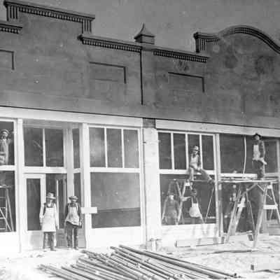 Building what would be the White House Cafe on the left, Front St. between 4th and 5th.