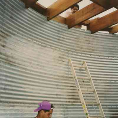Man standing inside a water tank