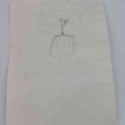 Back of artifact slip: The artifact slip features handwritten notes and a simple sketch of a rectangular object.