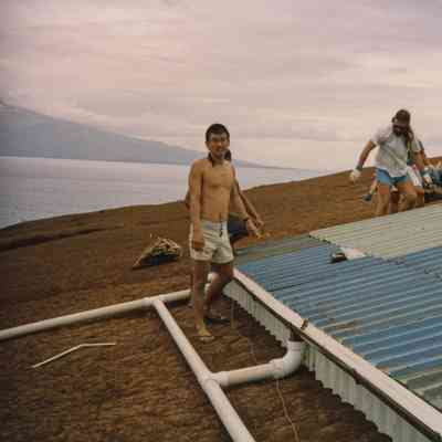 People working on water catchment structure