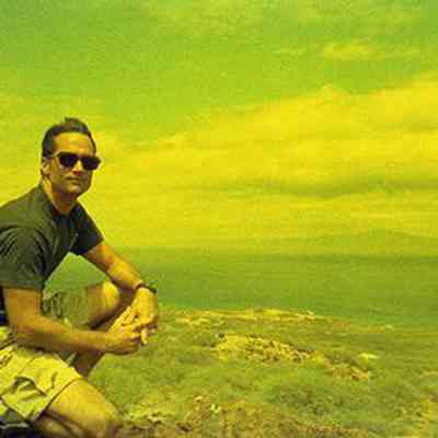 Unidentified man kneeling in unidentified area