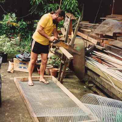 Man sawing a piece of wood